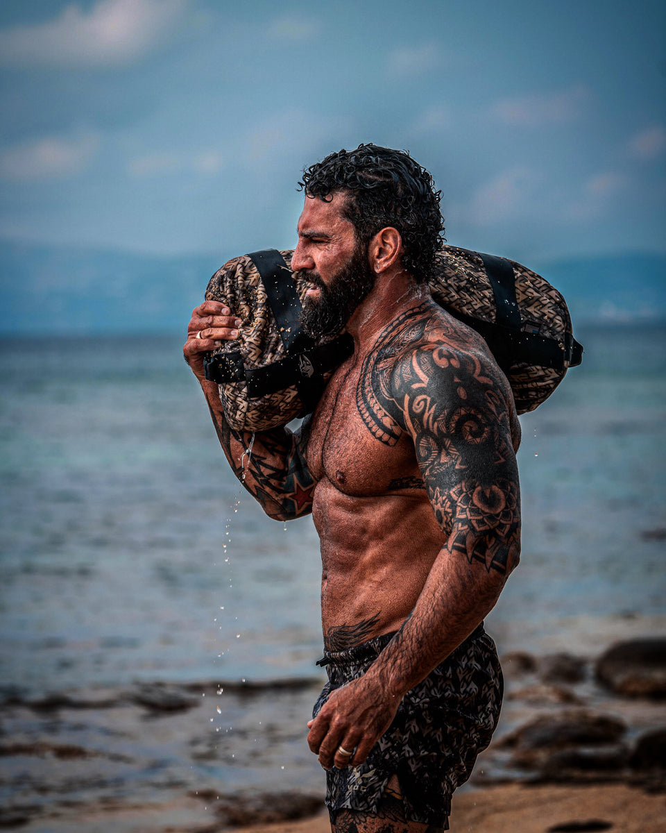 David Wood carrying Virtus sandbag